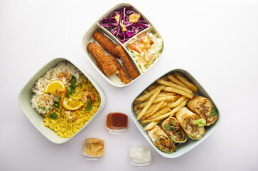 top down view,  Assorted takeout meal with rice, wraps, fries, and salad