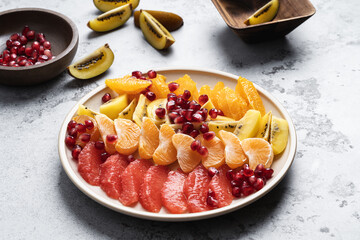 Tropical fruit salad dessert, healthy vegan food, close up