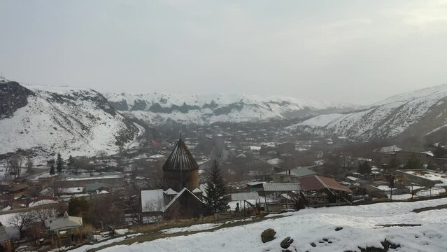 Aerial view of Surp Sargis church (7th century) on cloudly winter day. Bjni village, Kotayk Province, Armenia.