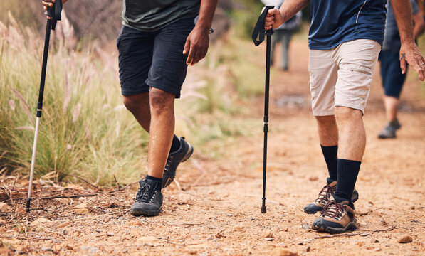 Hiking, Fitness And Feet Of People Walking On Mountain For Adventure, Freedom And Journey In Nature. Travel, Retirement And Shoes Of Hikers With Walk Cane For Exercise Wellness, Trekking And Workout