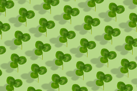 Clover leaf pattern on colored background. Abstract background for St. Patrick's Day