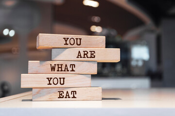 Wooden blocks with words 'You are what you eat'.