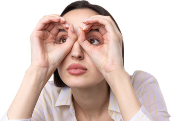 Close up portrait of attractive quirky young woman making binoculars with hands showing ok gesture on white studio background.