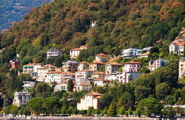 Fototapeta na wymiar Small town on green hill in summer, Italy