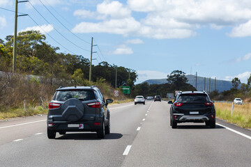 Driver with full licence overtaking p plate driver in car on highway