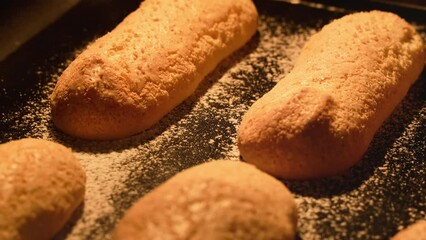 Process of cooking homemade ladyfinger cookies. Process of making sweet pastry. Timelapse of baking savoiardi cookies for tiramisu dessert. Food concept. Close-up in 4K, UHD