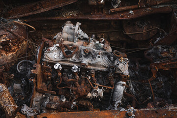 Fototapeta premium War in Ukraine, burnt civilian cars, burnt car engine, Irpin city, Kyiv region.