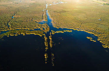 Sunrise over Comana Natural Park. Aerial view of this beautiful natural park with lakes birds and...
