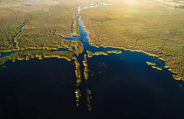 Sunrise over Comana Natural Park. Aerial view of this beautiful natural park with lakes birds and...
