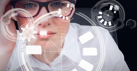 Multiple round scanners against portrait of caucasian woman against black background