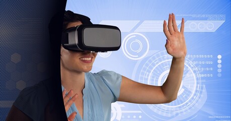Data processing over caucasian woman wearing vr headset against black technology background