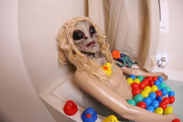 Spooky female alien in the bathtub