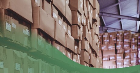 Green technology background over stack of cardboard boxes in the warehouse