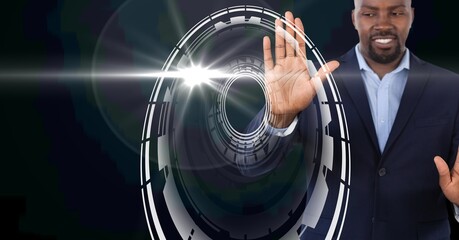 Composition of smiling businessman touching screen with scope scanning