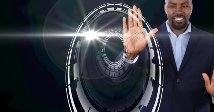 Composition of smiling businessman touching screen with scope scanning