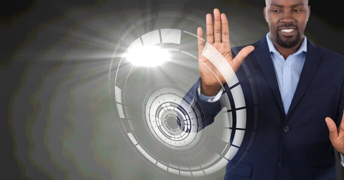 Composition of smiling businessman touching screen with scope scanning