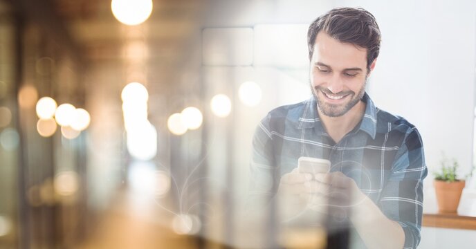 Composition of smiling caucasian businessman using smartphone with copy space