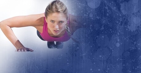 Composition of fit caucasian woman doing press ups in gym with blue blur