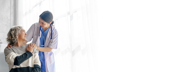 Young asian caretaker with 60s asia elderly woman consulting and encourage, take a history and...