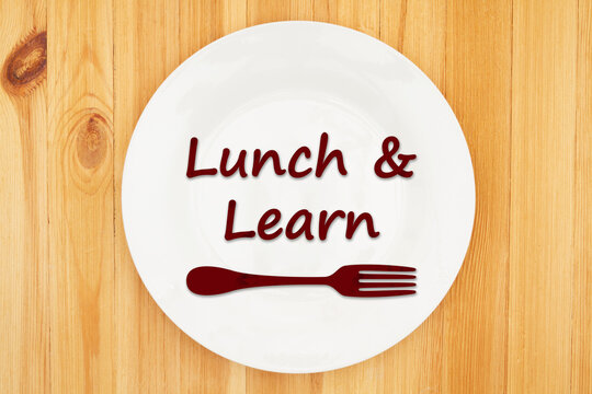 Lunch and Learn message on a plate on wood table