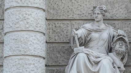 Vienna, Austria - Sculpture of powerful woman with hammer and severed head known as Bildhauerei located museums district, downtown in Vienna, Austria