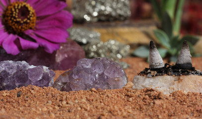 Amethyst Crystals and Chakra Stones on Australian Red Sand. Meditation Table
