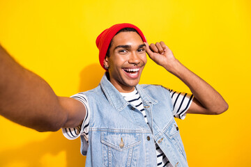 Photo of young glad man wear trendy clothes outfit recording video speaking followers subscribers isolated on yellow color background