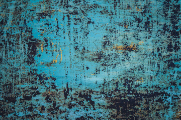 Shabby cracked paint on rusty metal surface background.