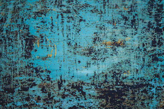 Shabby cracked paint on rusty metal surface background. © Viktor Kulikov
