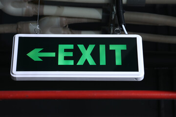 exit sign on the wall - obrazy, fototapety, plakaty