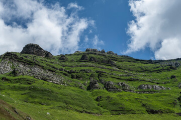 Fototapeta na wymiar Karst landforms in green steep mountain slope