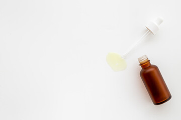 Essential serum oil in dropper bottle with pipette, top view