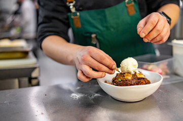 chef cooking dessert in the kitchen