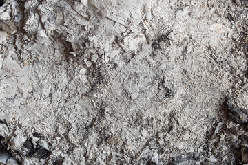 Top view of details and texture of a background of ashes in a close-up. Natural abstract texture.