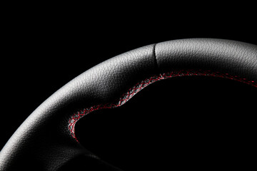 High-quality, detailed photo of a freshly repaired leather steering wheel with a black background and studio lighting. Perfect for automotive, fashion, and design industries.