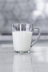 Glass of fresh yogurt in a glass cup. vertical