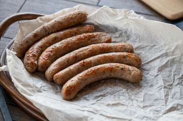 Grilled sausages with sauce and vegetables. Summer rest concept