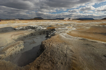 Beautiful colourful Icelandic landscape lava fields mountain geysers zigzag road and moss-covered...