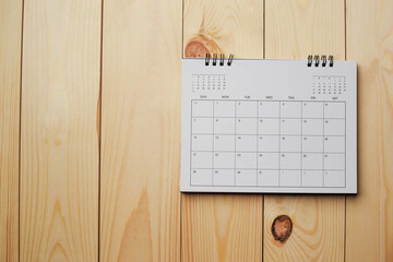 Embroidered red pins on a calendar event Planner calendar,clock to set timetable organize schedule,planning for business meeting or travel planning concept.