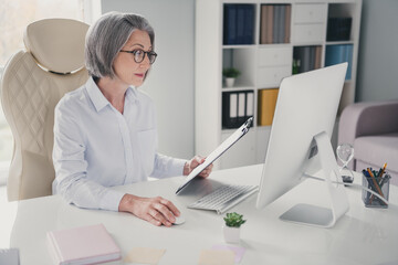Photo of busy confident lady broker dressed white shirt eyewear creating project indoors workstation workshop