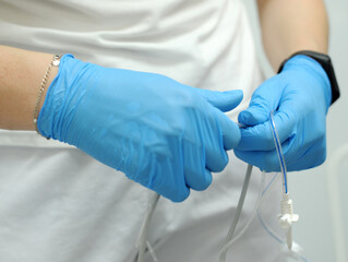 saline gloves dentistry The nurse collects the saline solution of sodium chloride from bottle into the syringe. Antibiotic breeding, vaccination, prevention and treatment of diseases