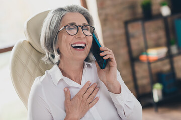 Photo of excited happy lady coach wear white shirt eyeglasses smiling laughing speaking modern...