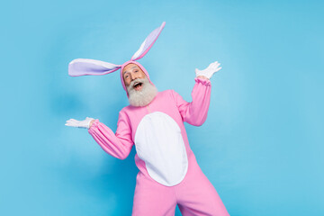 Portrait of crazy positive impressed elderly pensioner wear pink bunny costume staring open mouth...