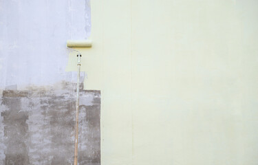 Painting brush moving on wall for paint the old color in new tone of decoration