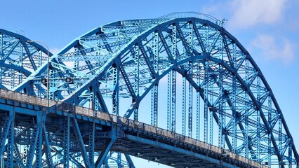Fototapeta na wymiar Transportation and travel across South Grand Island Bridge over Niagara River near Buffalo, New York beautiful architecture and engineering with blue sky