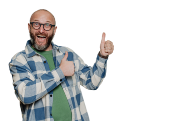 Excited mid adult Caucasian bald beardy man in spectacles, plaid shirt screams with wide opened mouth and eyes gestures thumb up points at empty space over transparent background. Mockup, sale.