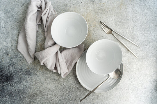 Minimalistic table setting on concrete table