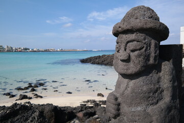 The coast of Jeju Island and the mascot made of basalt