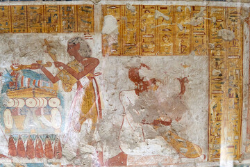 A colorful mural with the deceased in front of altar with offerings - the tomb of Neferrenpet, TT 178, Luxor Western bank © Svetlaili