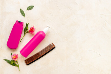Set of hair care and styling products with flowers